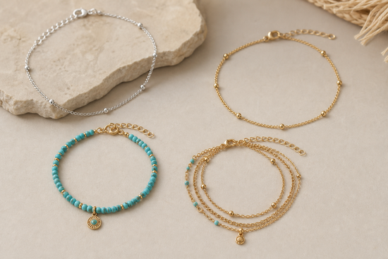 Several women's anklets in silver, gold, and beaded styles arranged on a neutral surface