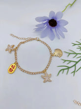 Silver 2-in-1 charm anklet bracelet with sparkly figure-8 chain, starfish and seashell accents