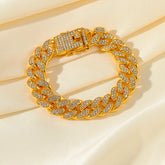 Gold chain bracelet with clear stones on a beige background