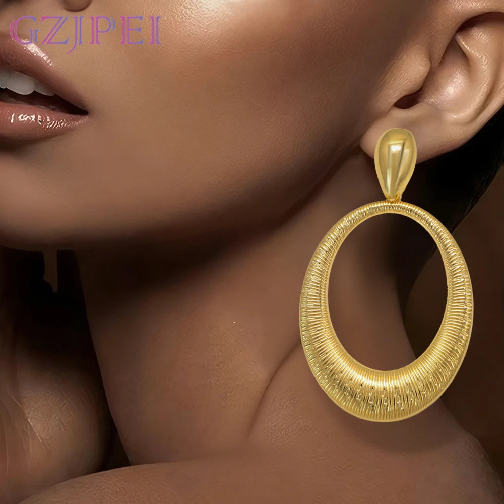 GZJPEI large gold geometric drop earrings with round exaggerated design in 18K gold-plated zinc alloy