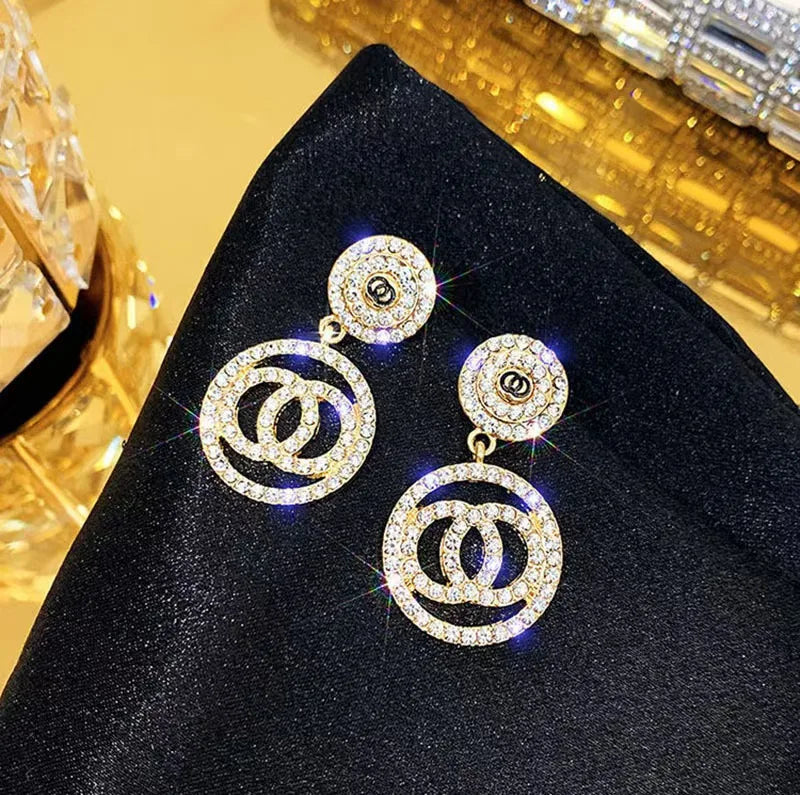 Pearl circle stud earrings with retro long drop design in copper alloy for women