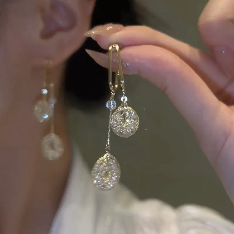 925 silver needle drop earrings with hollow water drop shape, long tassels, and simulated pearl detail