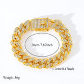 Gold chain bracelet with measurements and weight on a white background