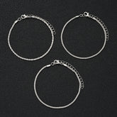 5-piece boho anklet set with metal chains, faux pearls, and butterfly, star, and heart pendant charms