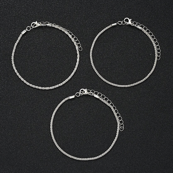 5-piece boho anklet set with metal chains, faux pearls, and butterfly, star, and heart pendant charms