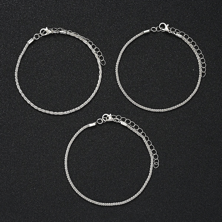 5-piece boho anklet set with metal chains, faux pearls, and butterfly, star, and heart pendant charms